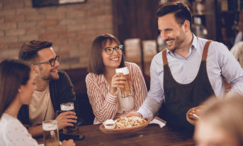 Image of people with beer at the table
