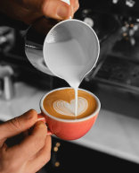 Image of a barista making coffee
